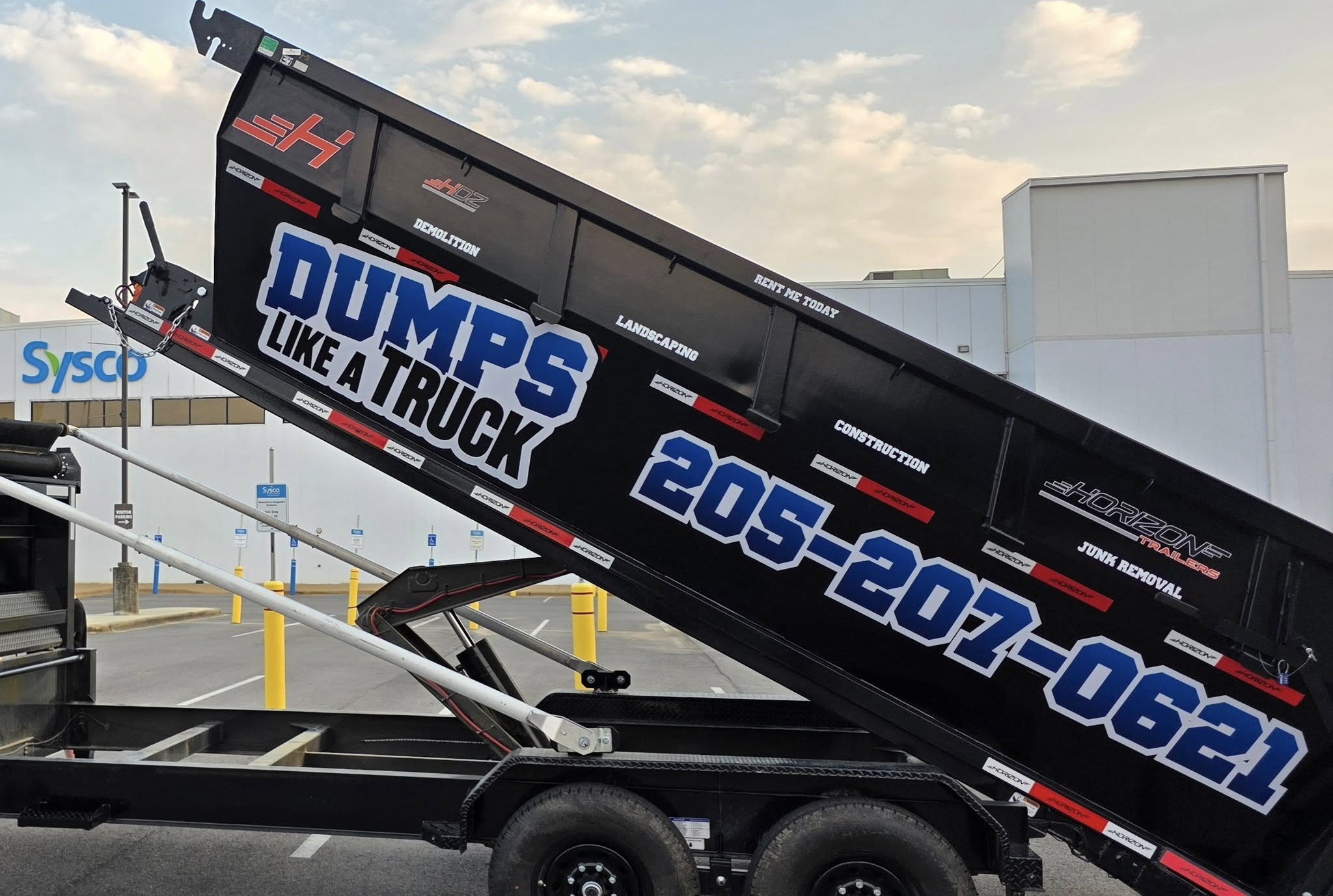 Dumps Like A Truck roll-off dump trailer in Calera, AL